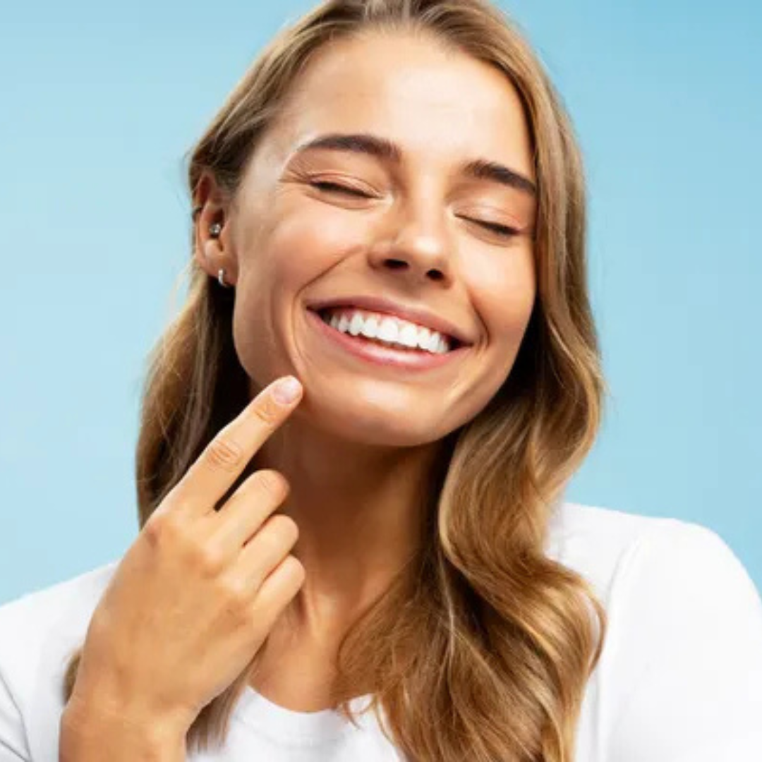 Woman smiling showing relief from InvisiRelief™ Chewing Gum
